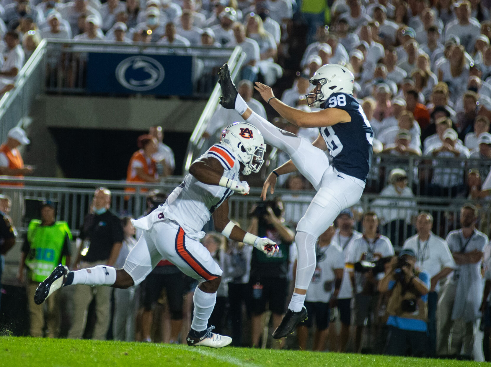 Jordan Stout (98) kicks football during White Out
